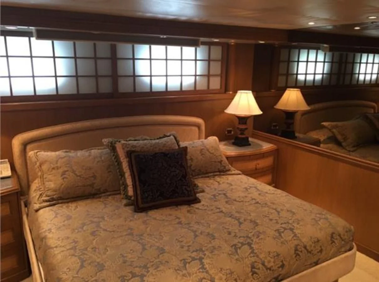 a bed with pillows aboard MYC Yacht for Sale