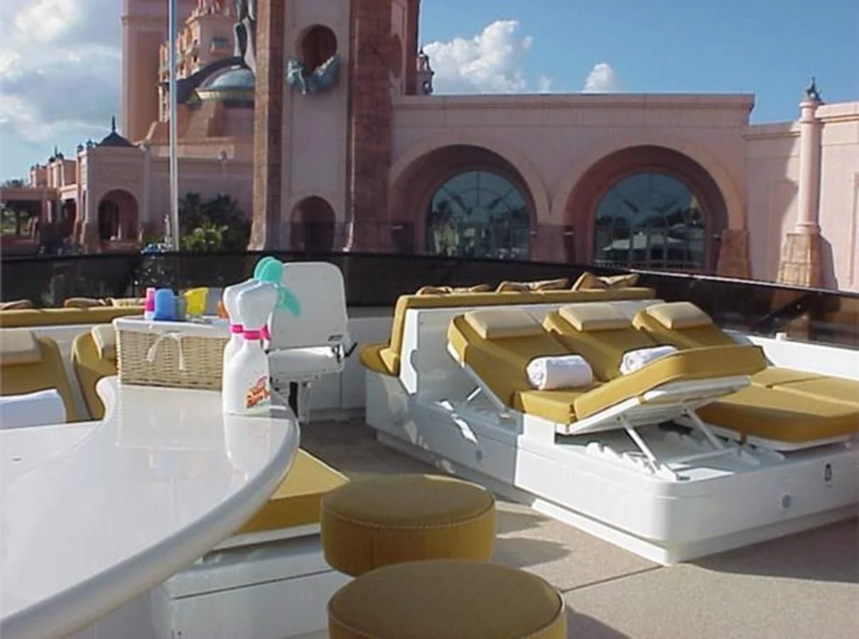 a yellow and white toy car aboard MYC Yacht for Sale
