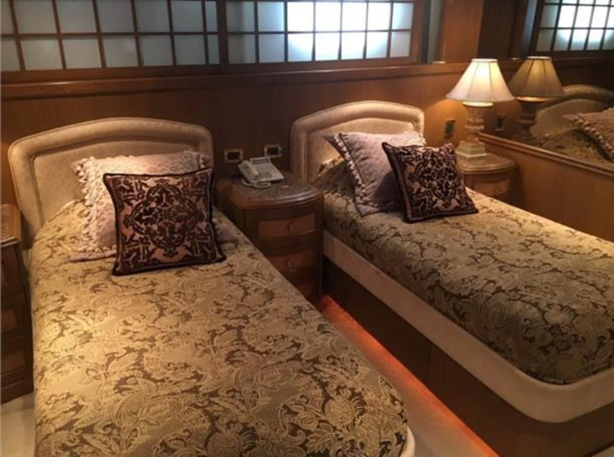 a couple of beds in a hotel room aboard MYC Yacht for Sale