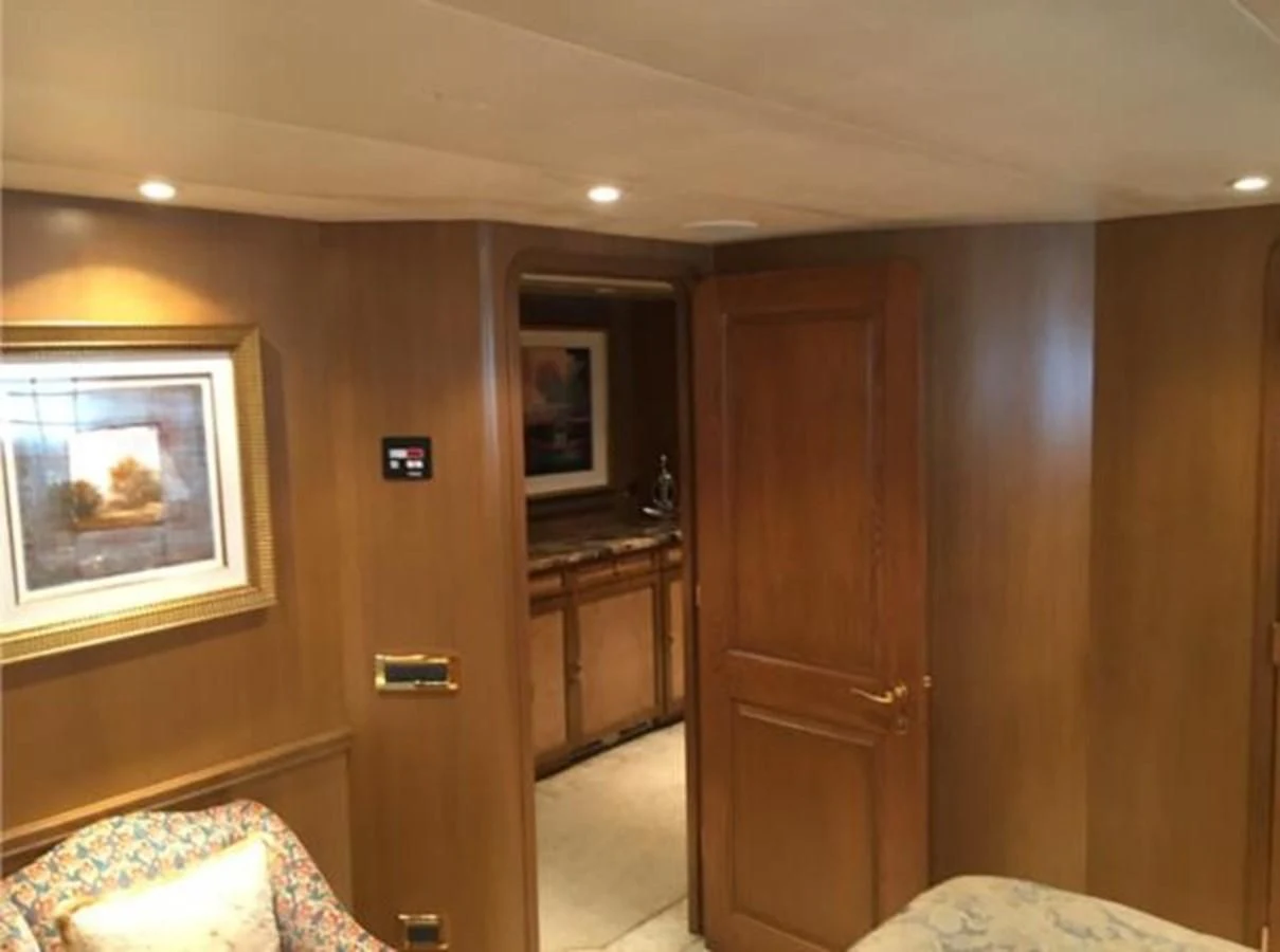a room with a door and a mirror aboard MYC Yacht for Sale