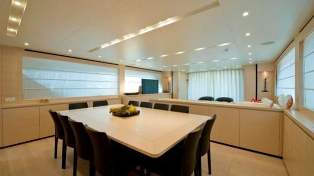 a large room with a table and chairs aboard ELYSIUM Yacht for Sale