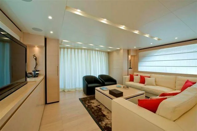 a living room with a large window aboard ELYSIUM Yacht for Sale