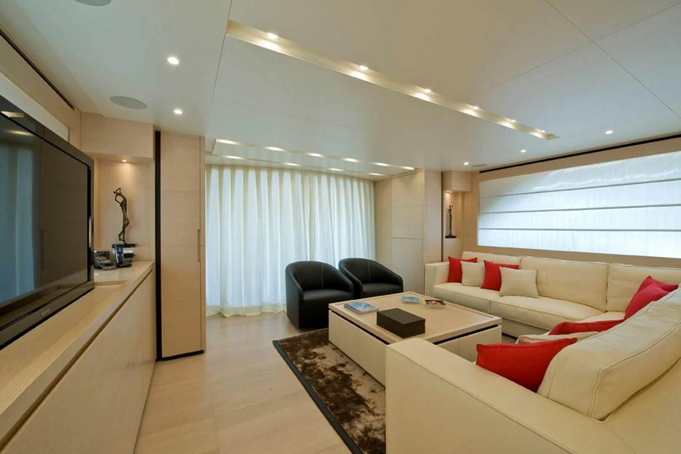 a living room with a large window aboard ELYSIUM Yacht for Sale