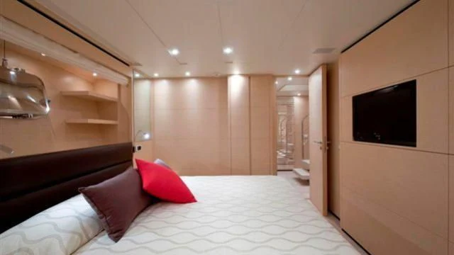a bed in a room aboard ELYSIUM Yacht for Sale