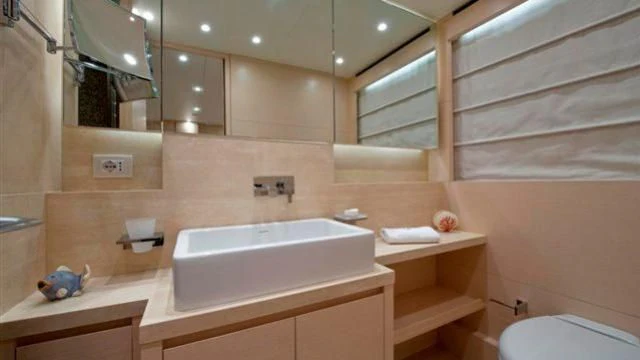 a bathroom with a sink and a mirror aboard ELYSIUM Yacht for Sale