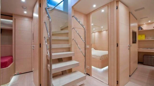 a room with a set of stairs aboard ELYSIUM Yacht for Sale