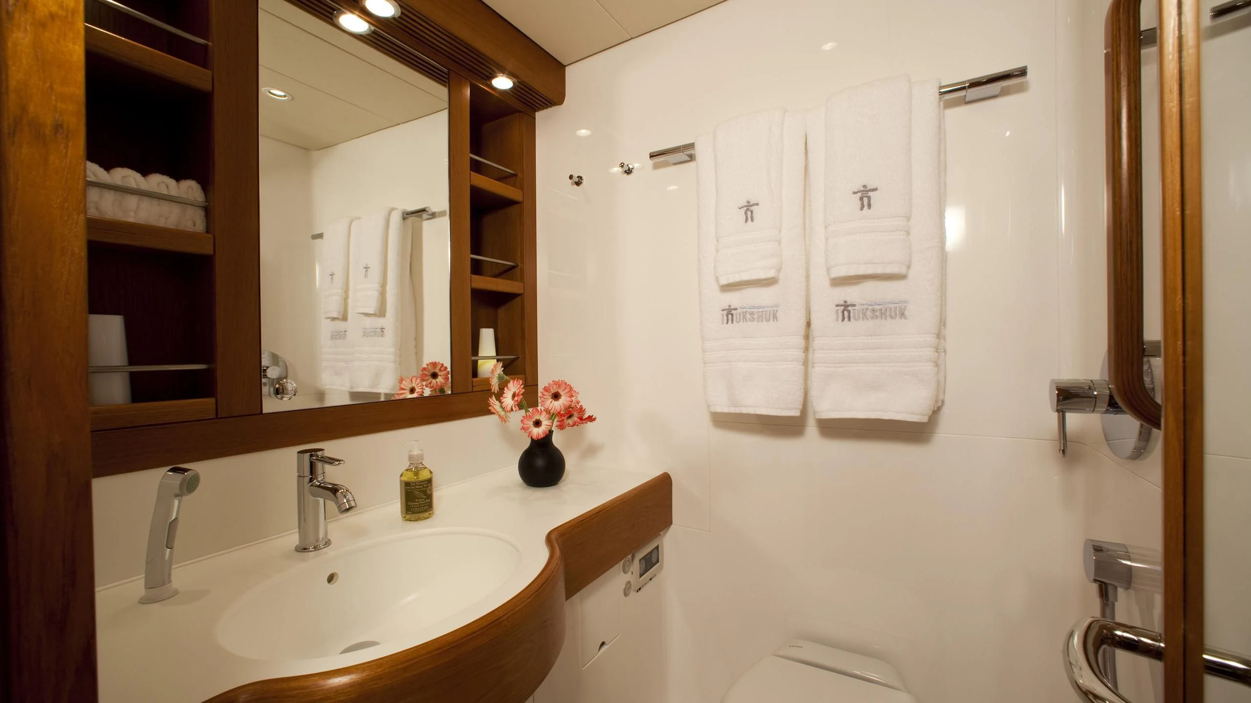 a bathroom with a large mirror aboard ELYSIUM Yacht for Sale