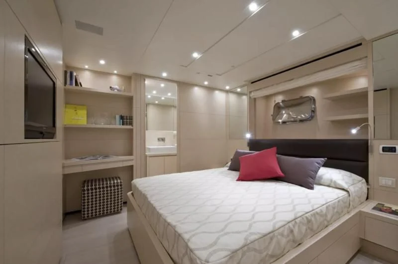 a large bed in a room aboard ELYSIUM Yacht for Sale