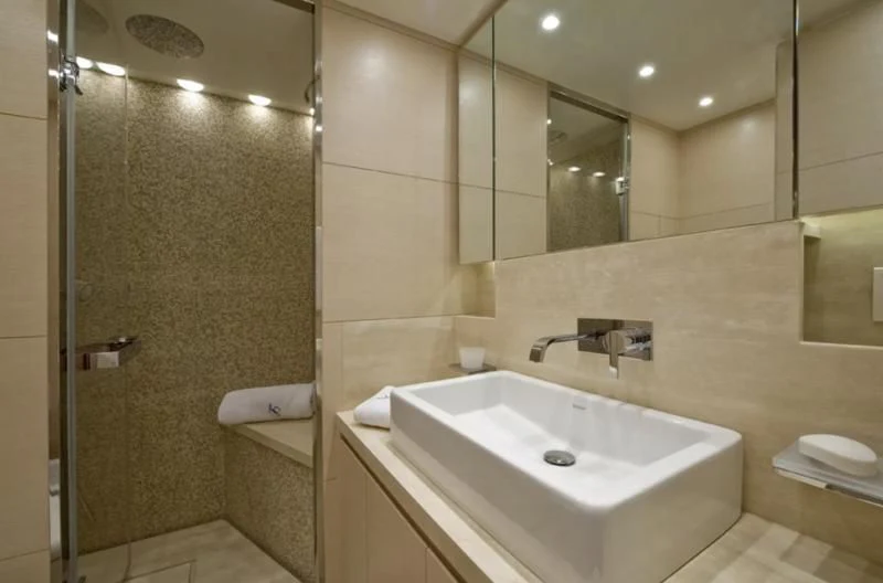 a bathroom with a sink and a shower aboard ELYSIUM Yacht for Sale