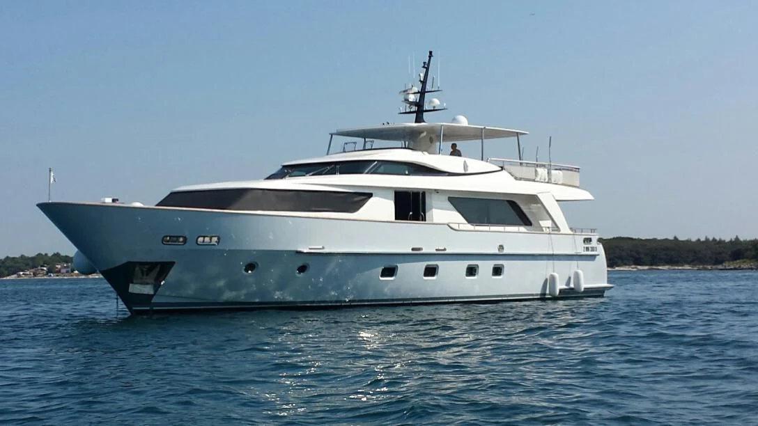 a white yacht on the water aboard ELYSIUM Yacht for Sale