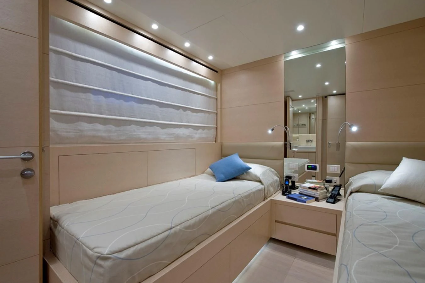 a room with a bed and a mirror aboard ELYSIUM Yacht for Sale