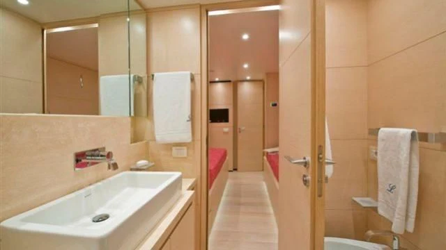 a bathroom with a sink and a mirror aboard ELYSIUM Yacht for Sale
