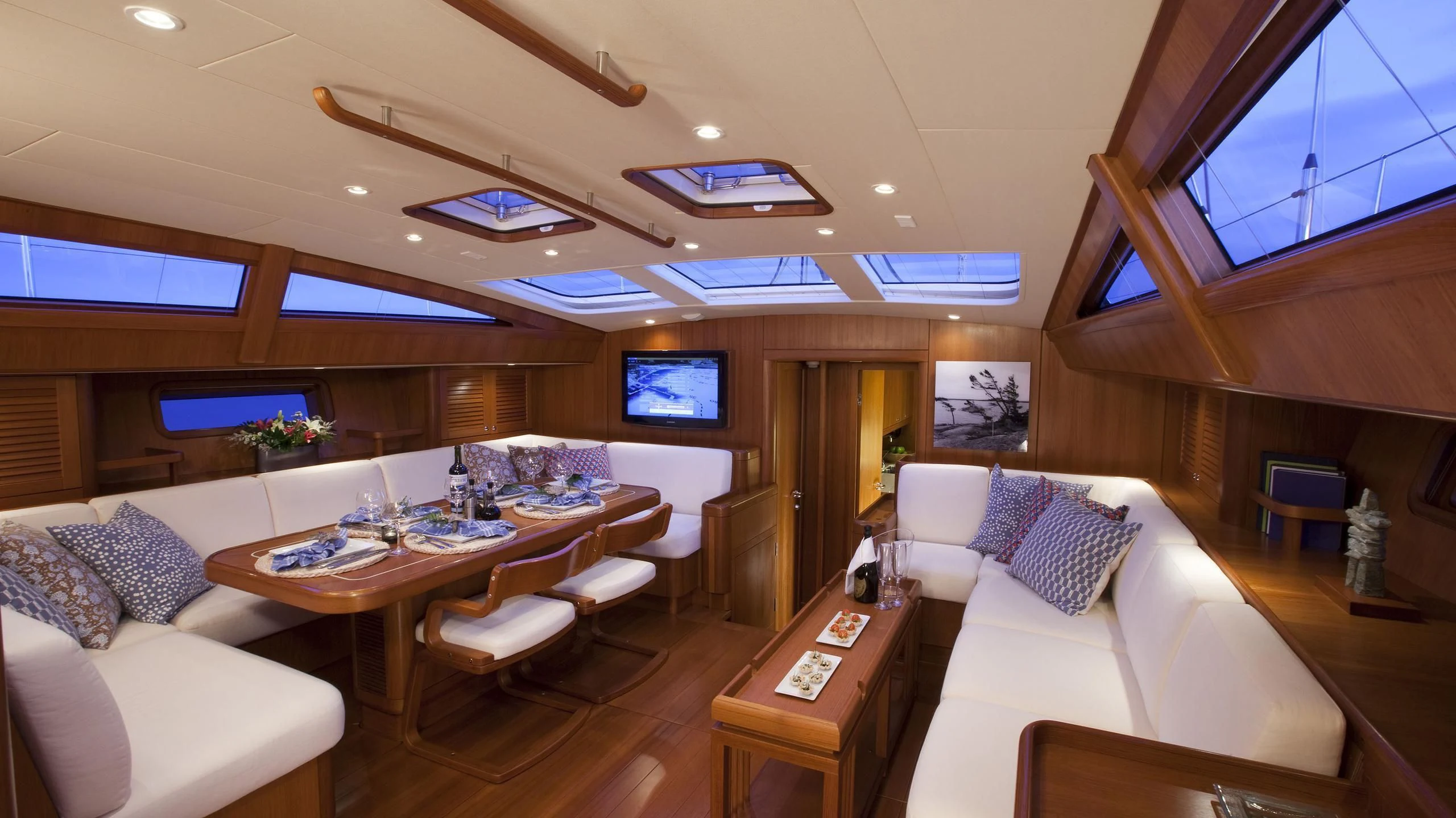 a living room with a couch and a table aboard ELYSIUM Yacht for Sale