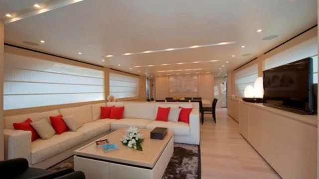 a living room with a couch and a tv aboard ELYSIUM Yacht for Sale