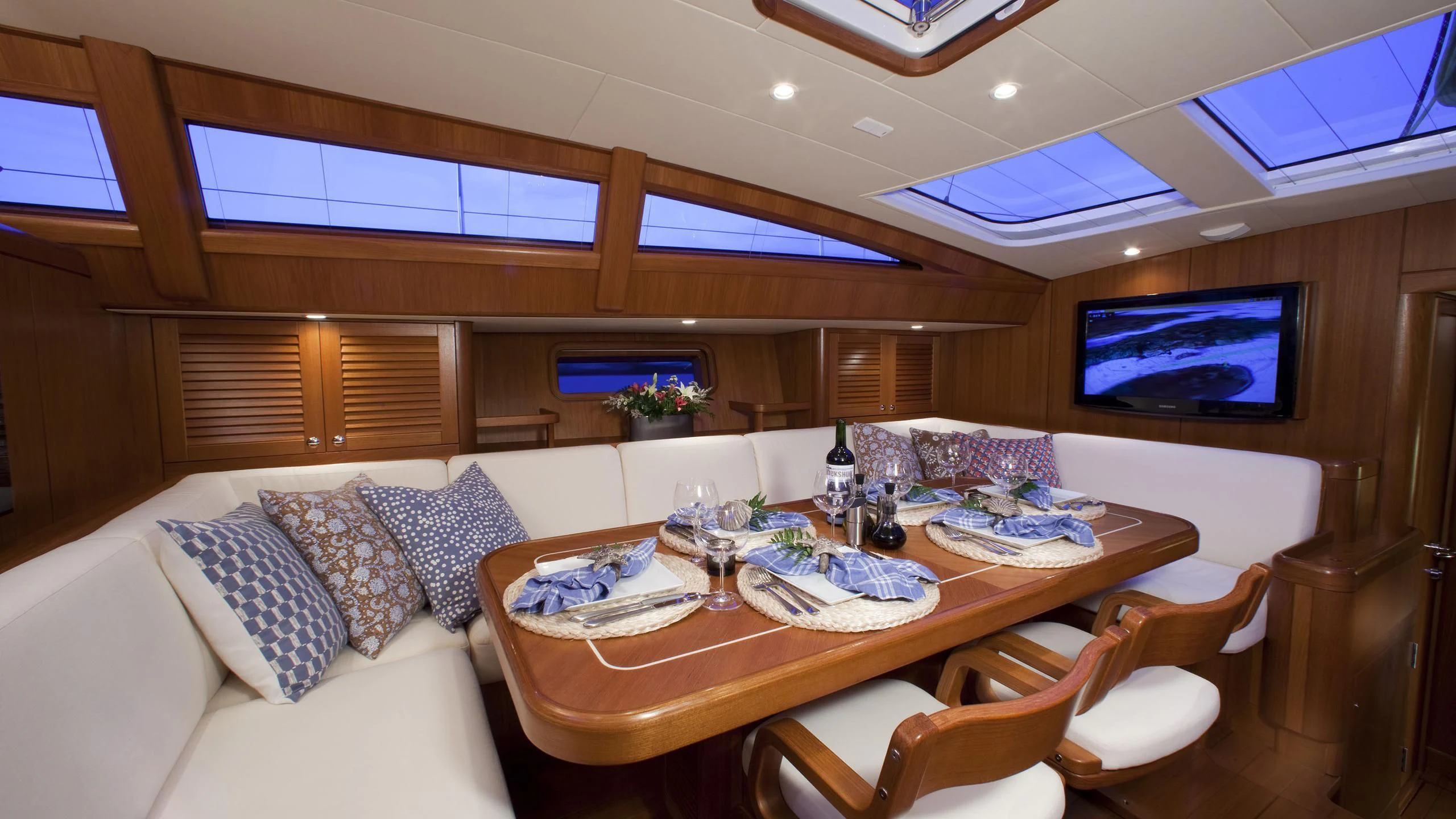 a room with a table and chairs aboard ELYSIUM Yacht for Sale