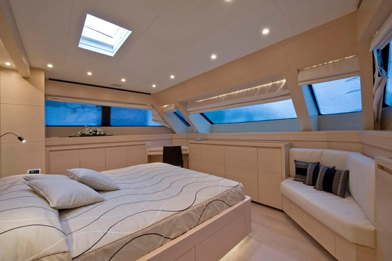 a room with a bed and a window aboard ELYSIUM Yacht for Sale