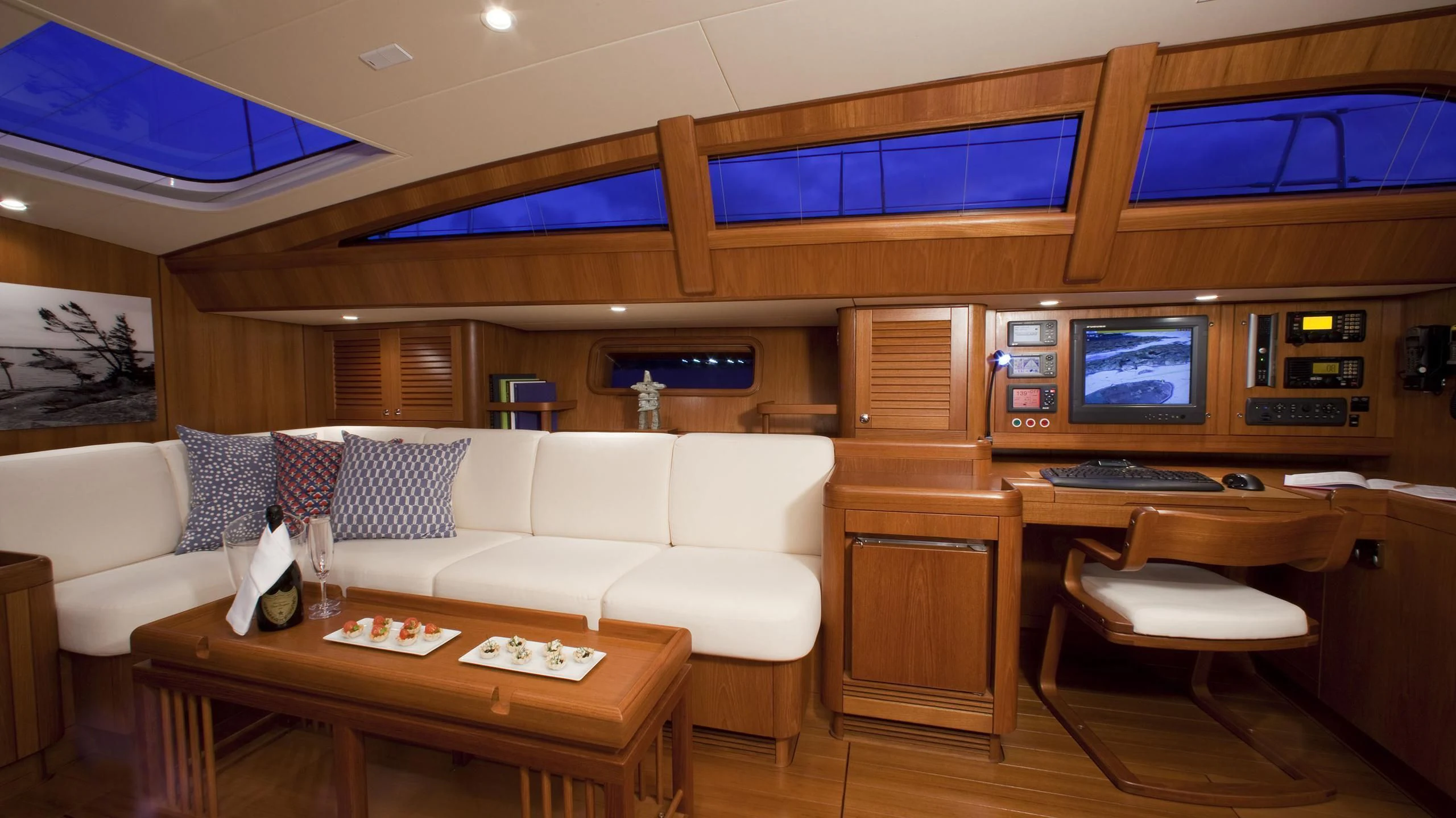 a room with a couch and a table aboard ELYSIUM Yacht for Sale