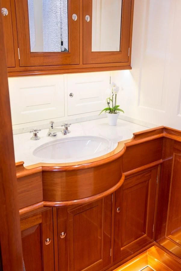 a bathroom with a sink and cabinets aboard ATALANTE Yacht for Sale