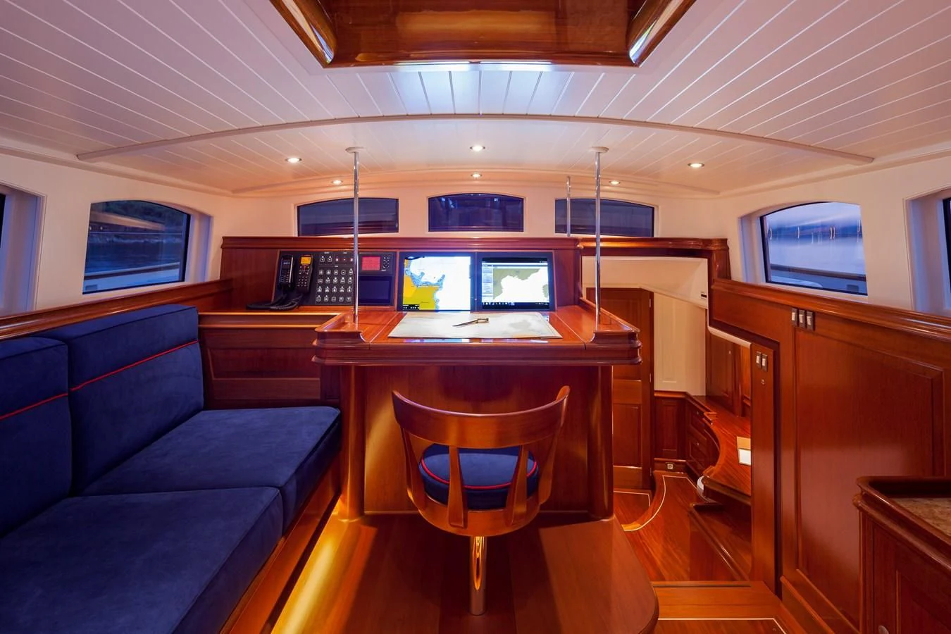 a room with a desk and a couch aboard ATALANTE Yacht for Sale