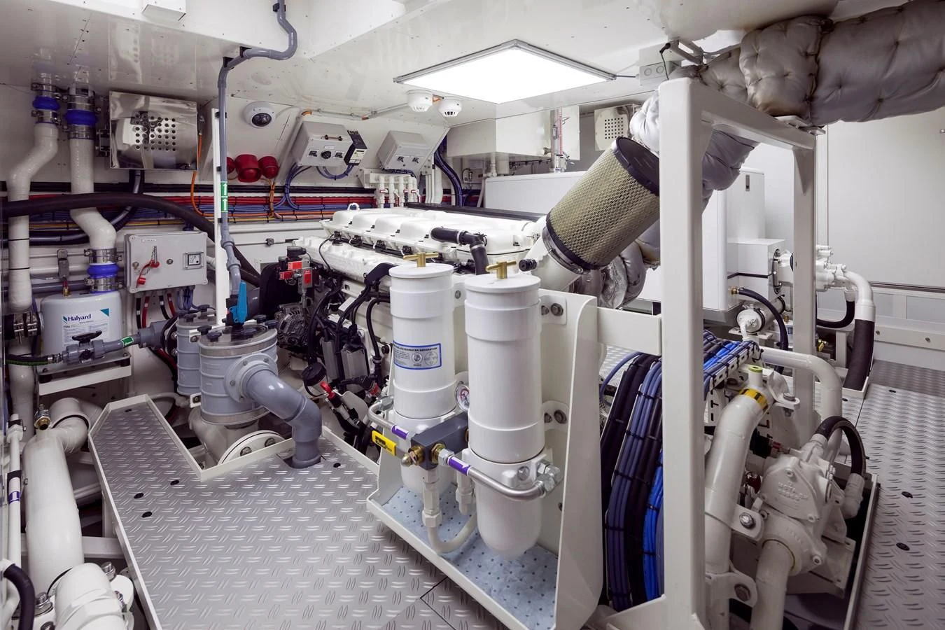 a room with several white pipes aboard ATALANTE Yacht for Sale