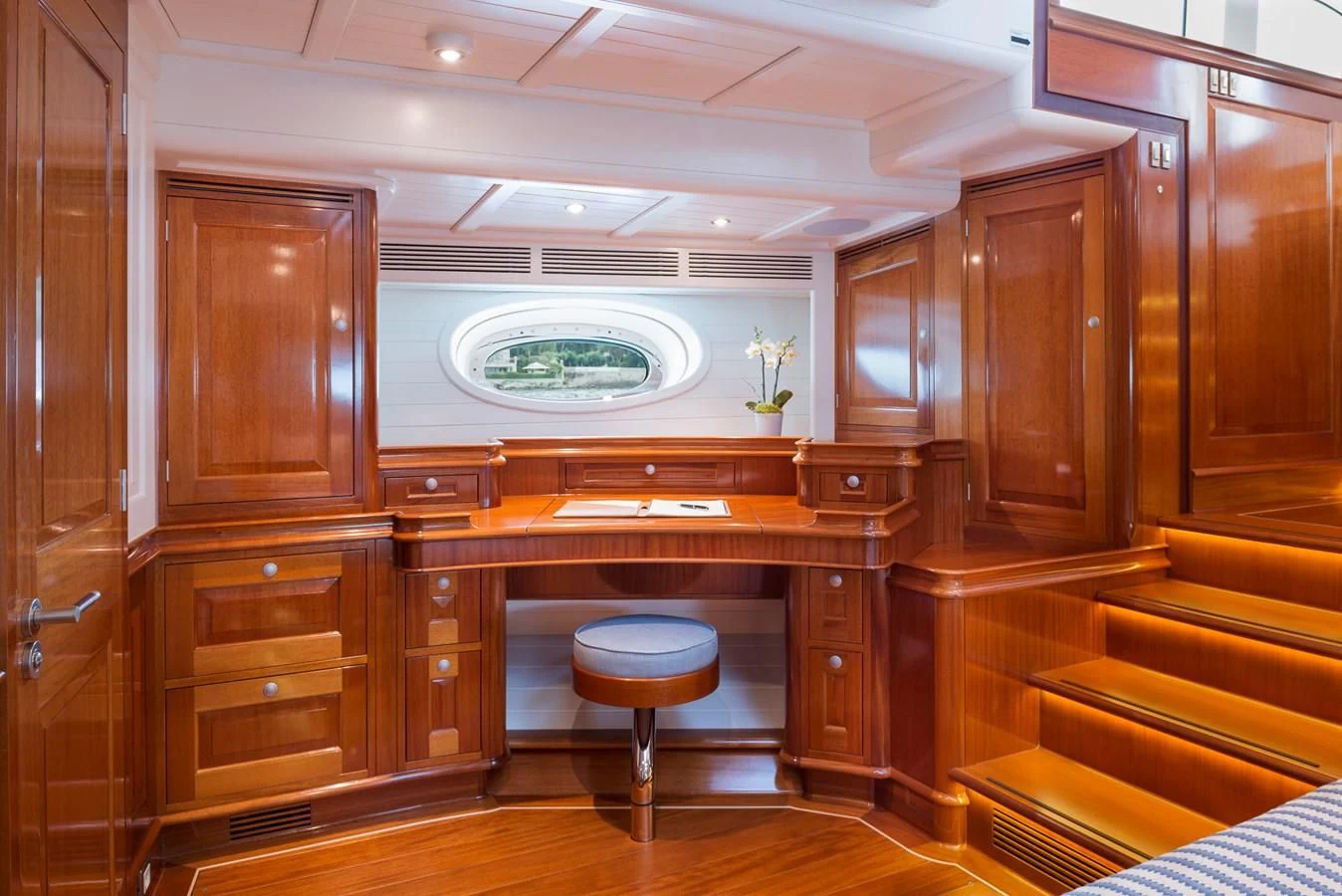 a large kitchen with wooden cabinets aboard ATALANTE Yacht for Sale