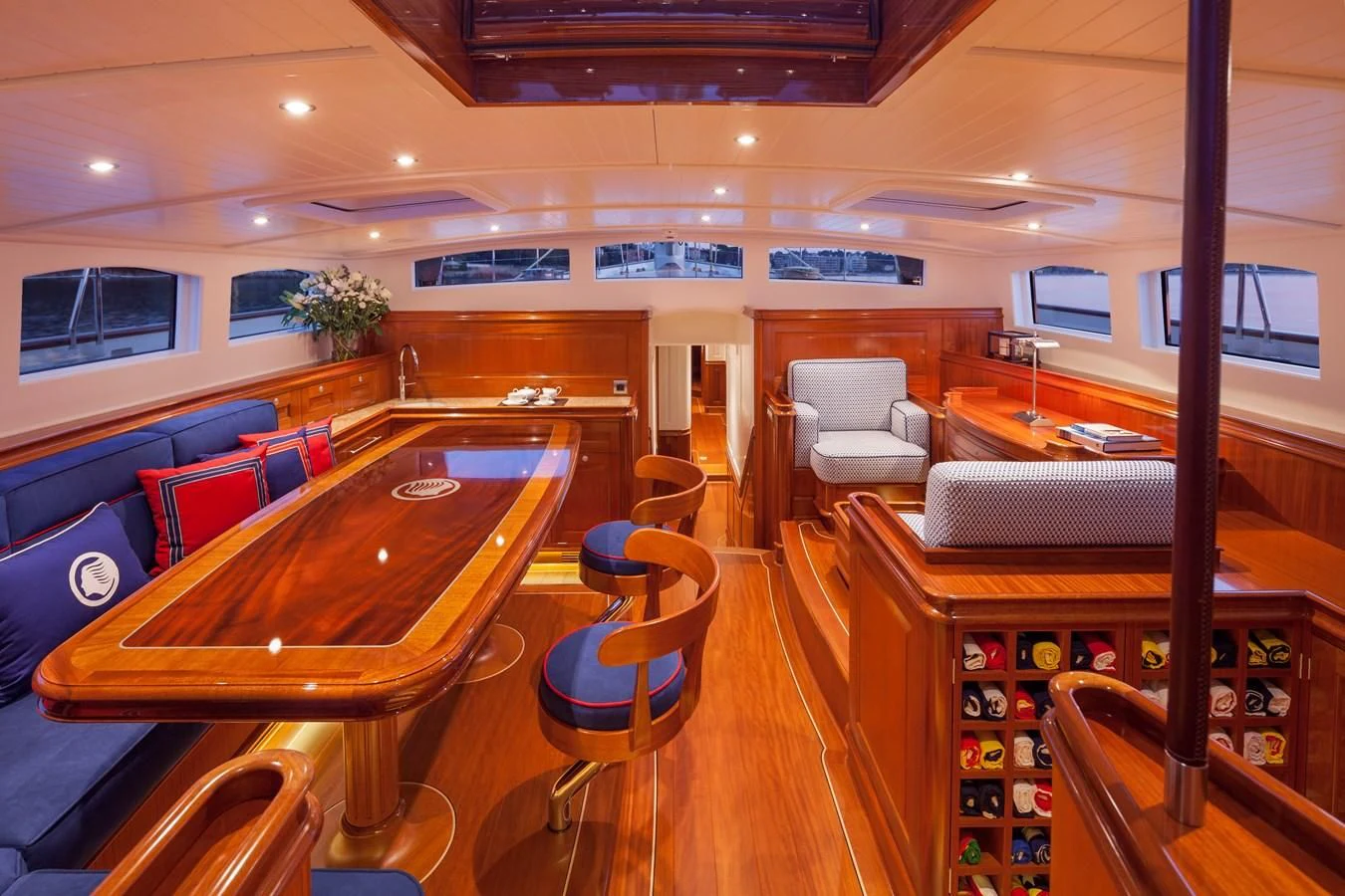 a room with a table chairs and a large window aboard ATALANTE Yacht for Sale