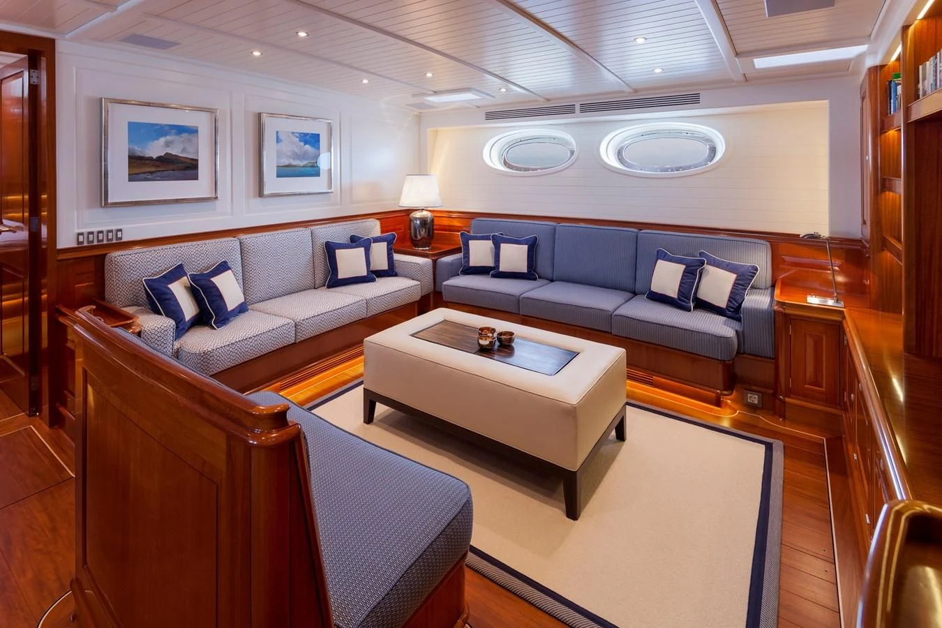 a living room with a couch and a coffee table aboard ATALANTE Yacht for Sale