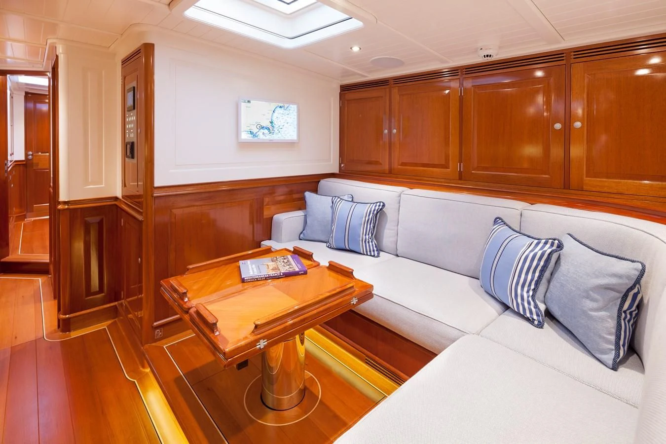 a living room with a couch and a table aboard ATALANTE Yacht for Sale