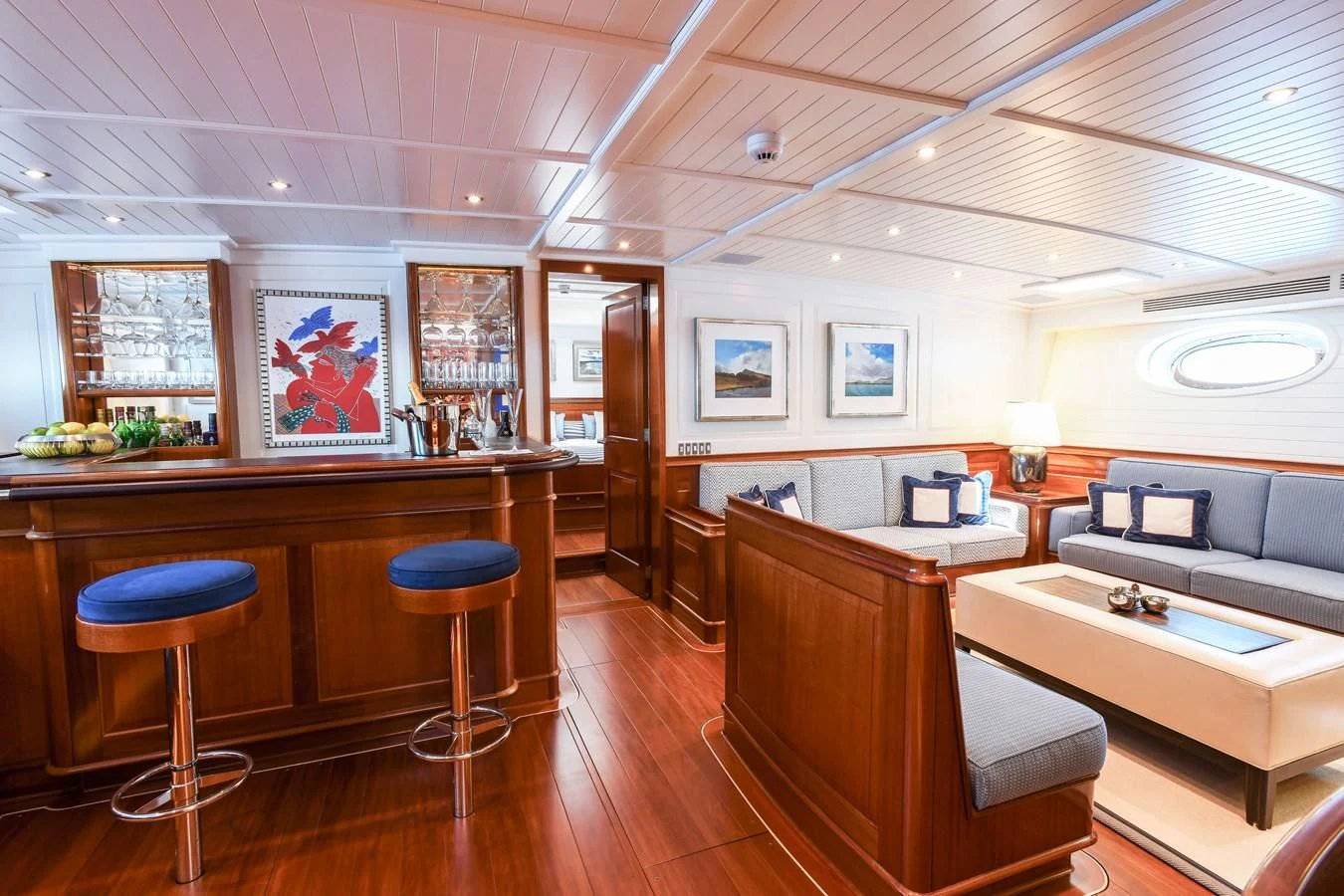 a room with a couch and a table and chairs aboard ATALANTE Yacht for Sale