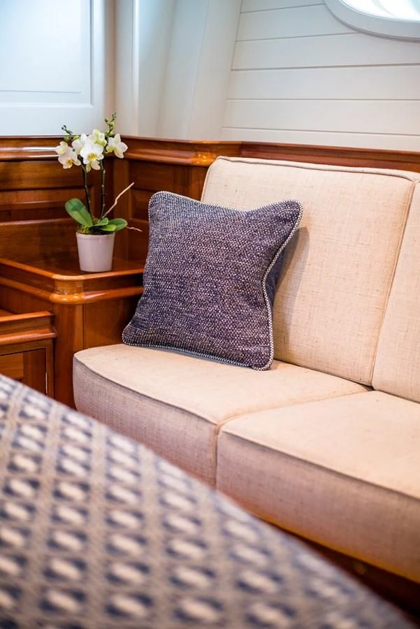 a couch with a flower on it aboard ATALANTE Yacht for Sale