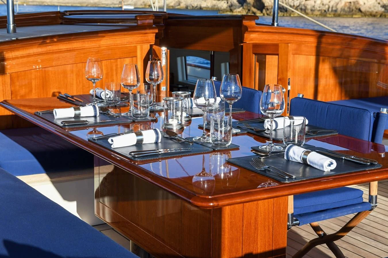 a table with wine glasses and napkins on it aboard ATALANTE Yacht for Sale
