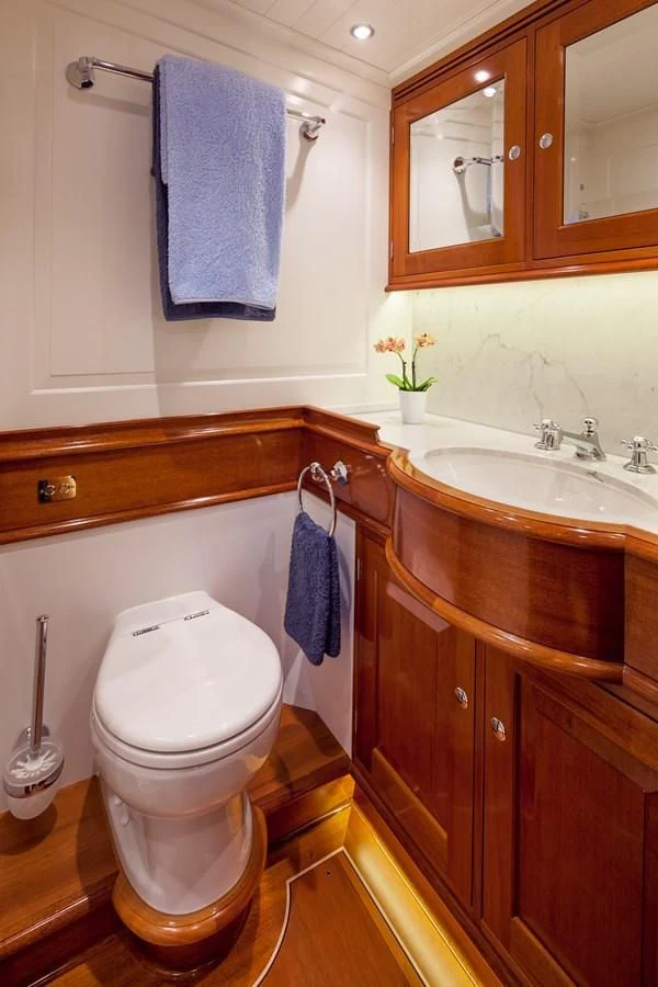 a bathroom with a toilet and sink aboard ATALANTE Yacht for Sale