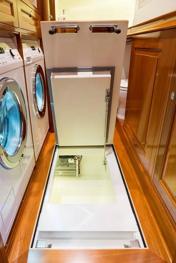 a washing machine in a room aboard ATALANTE Yacht for Sale