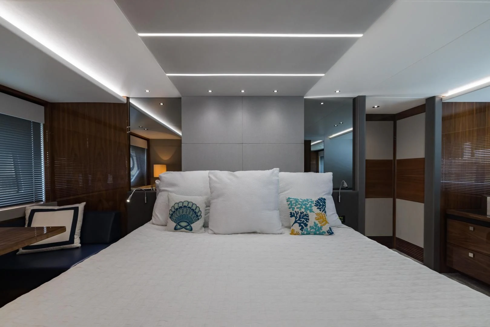 a large bed in a room aboard MR. G Yacht for Sale