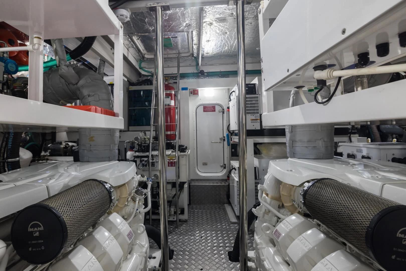 a room with several white pipes aboard MR. G Yacht for Sale