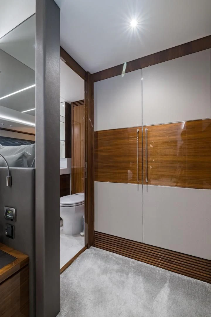 a bathroom with a toilet and a shower aboard MR. G Yacht for Sale