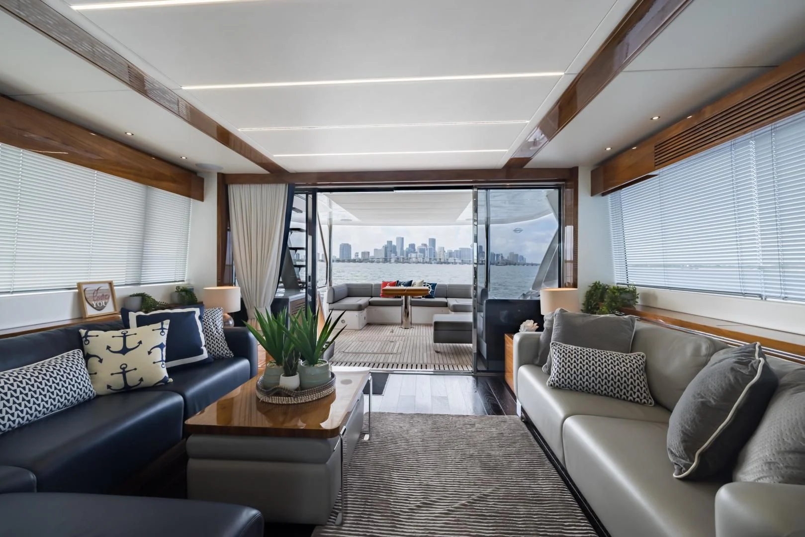a living room with a large window aboard MR. G Yacht for Sale