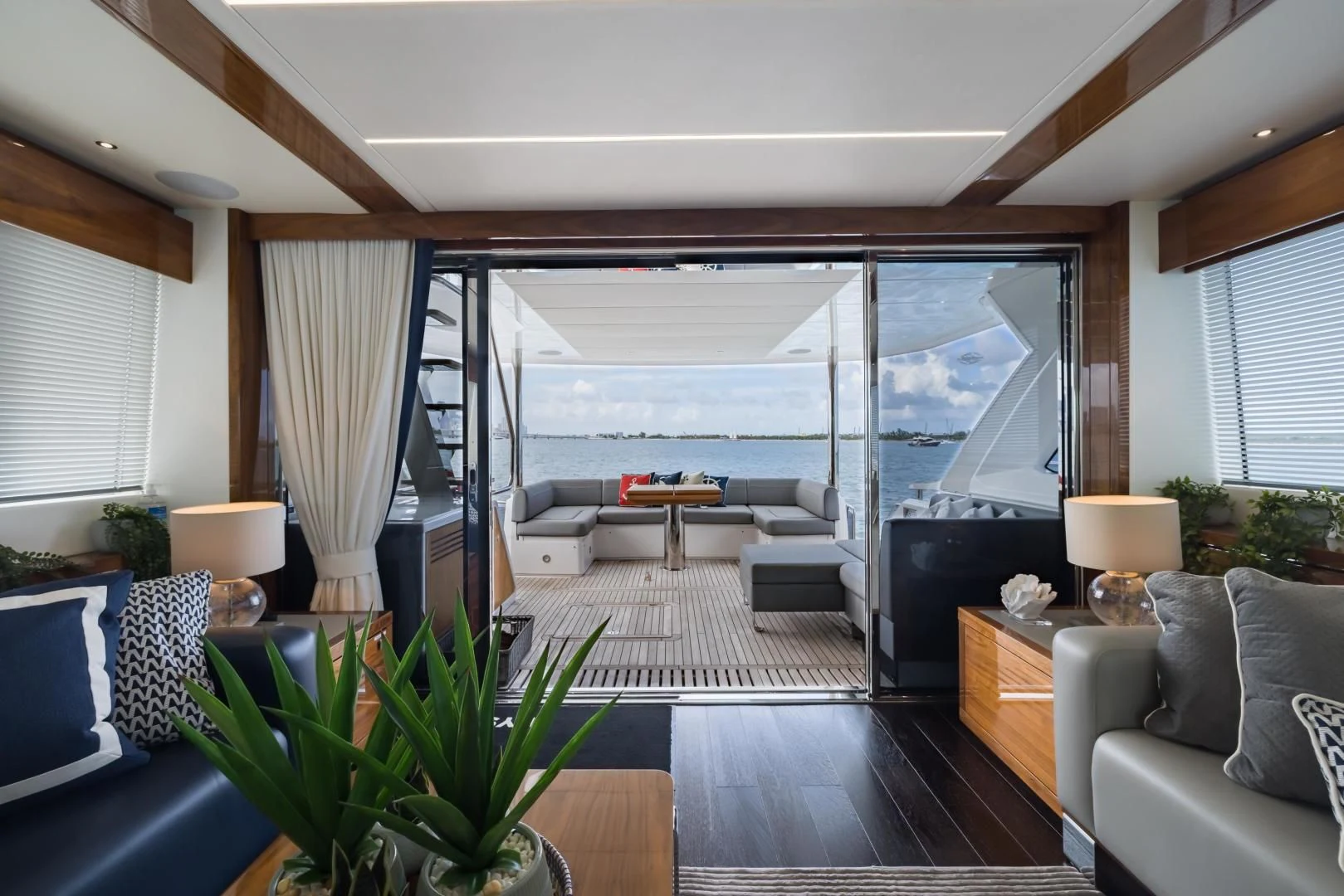 a living room with a large window aboard MR. G Yacht for Sale
