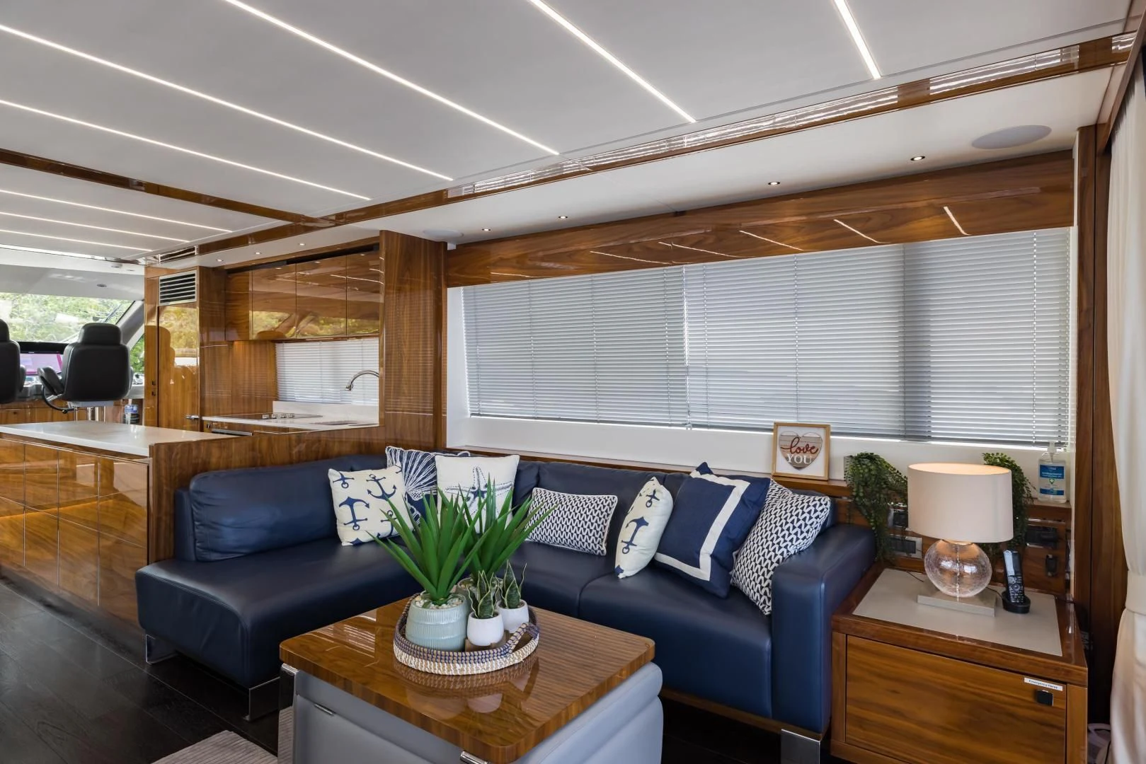 a living room with a blue couch aboard MR. G Yacht for Sale