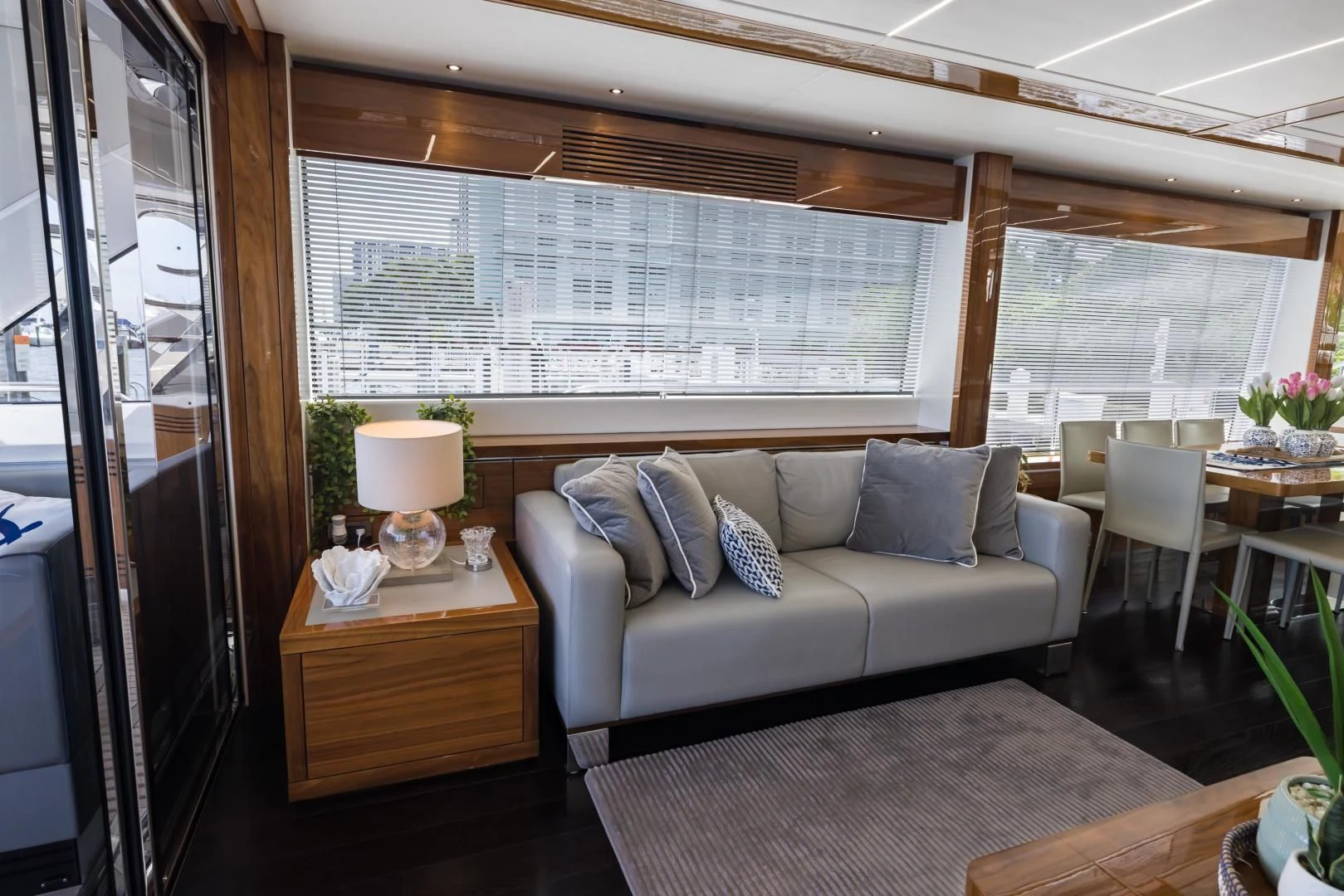 a living room with a couch and a table aboard MR. G Yacht for Sale