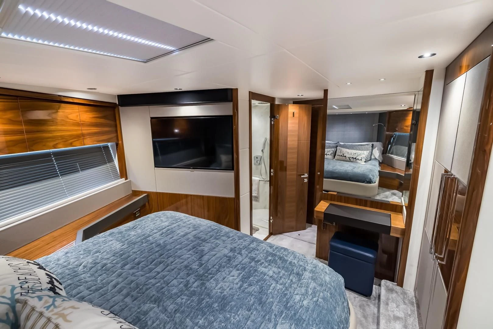 a bedroom with a bed and a television aboard MR. G Yacht for Sale