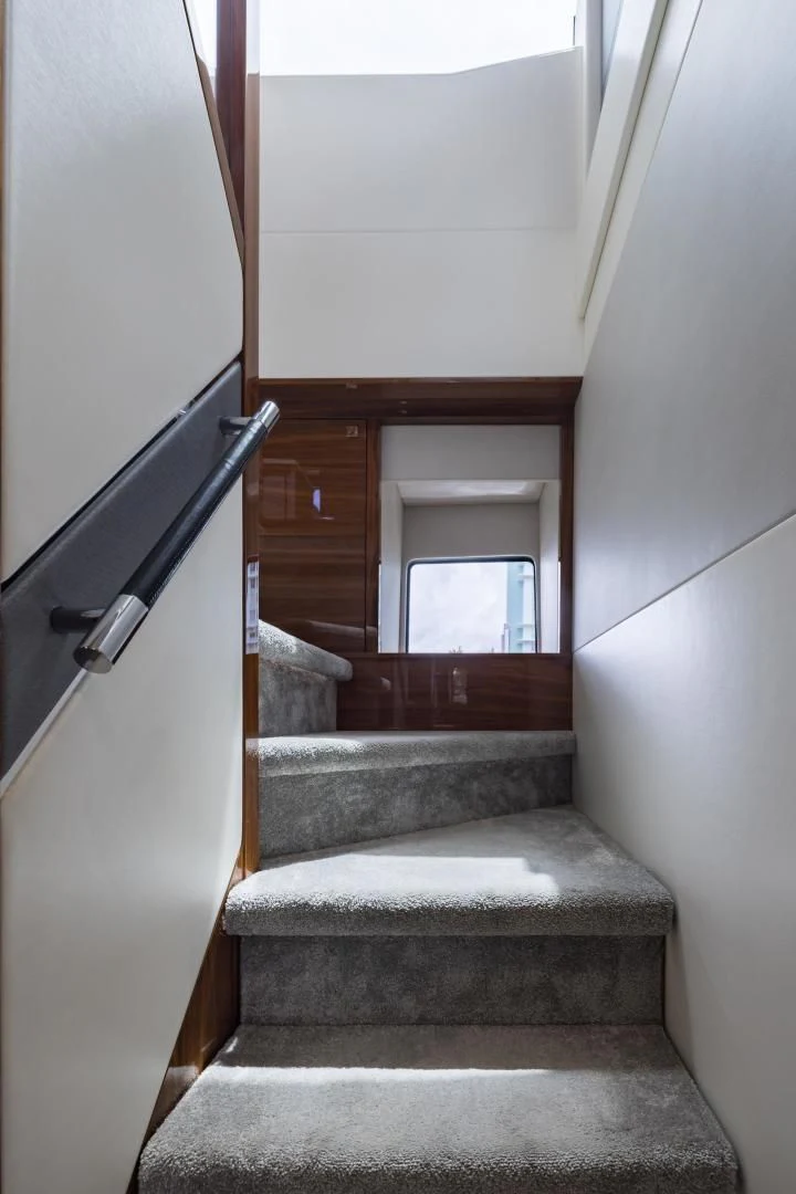a staircase with a railing aboard MR. G Yacht for Sale
