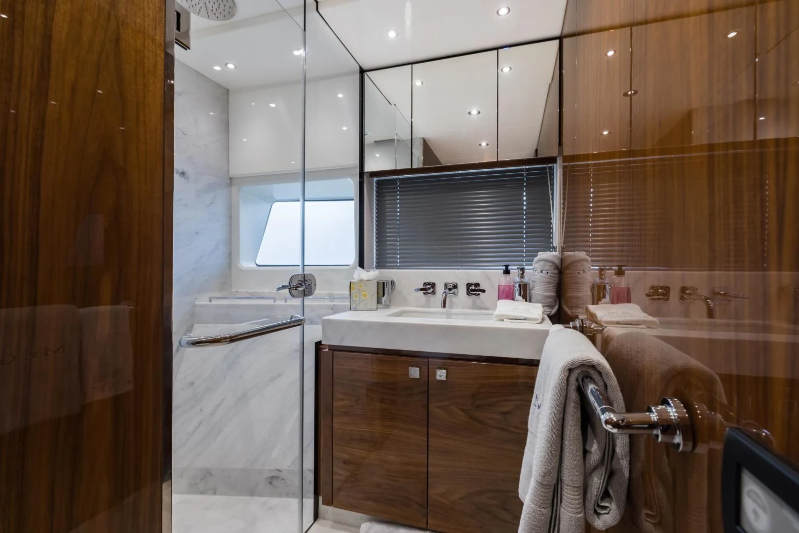 a bathroom with wooden cabinets aboard MR. G Yacht for Sale