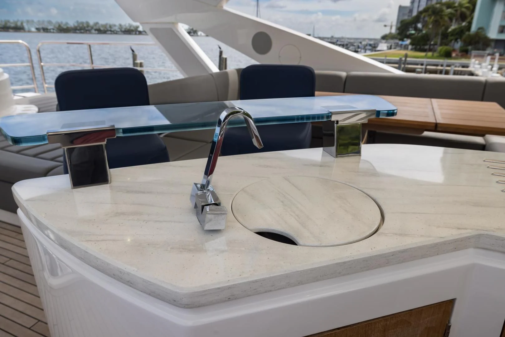 a white table with a black and silver object on it aboard MR. G Yacht for Sale