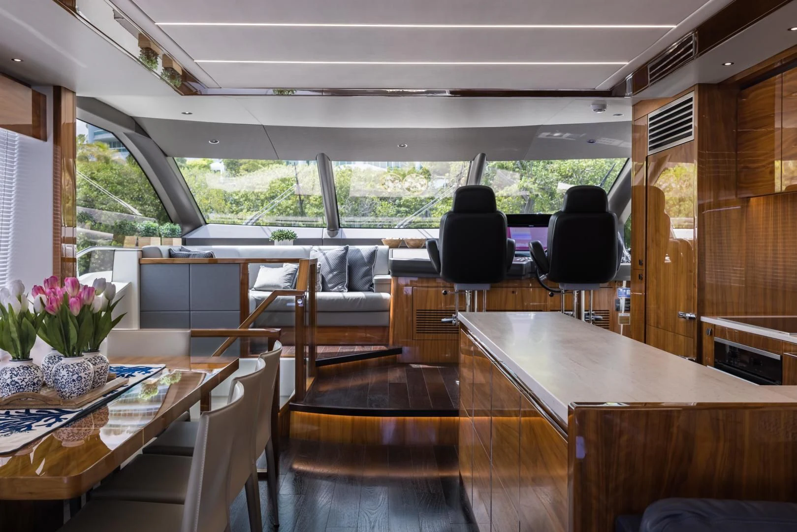 a room with tables and chairs aboard MR. G Yacht for Sale
