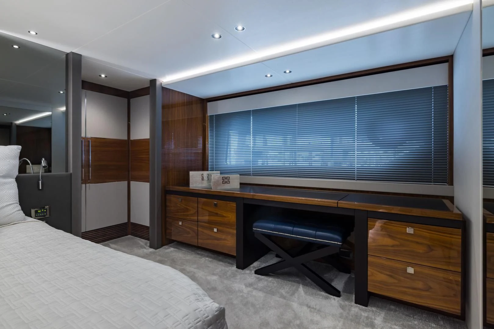 a room with a bed and a desk aboard MR. G Yacht for Sale