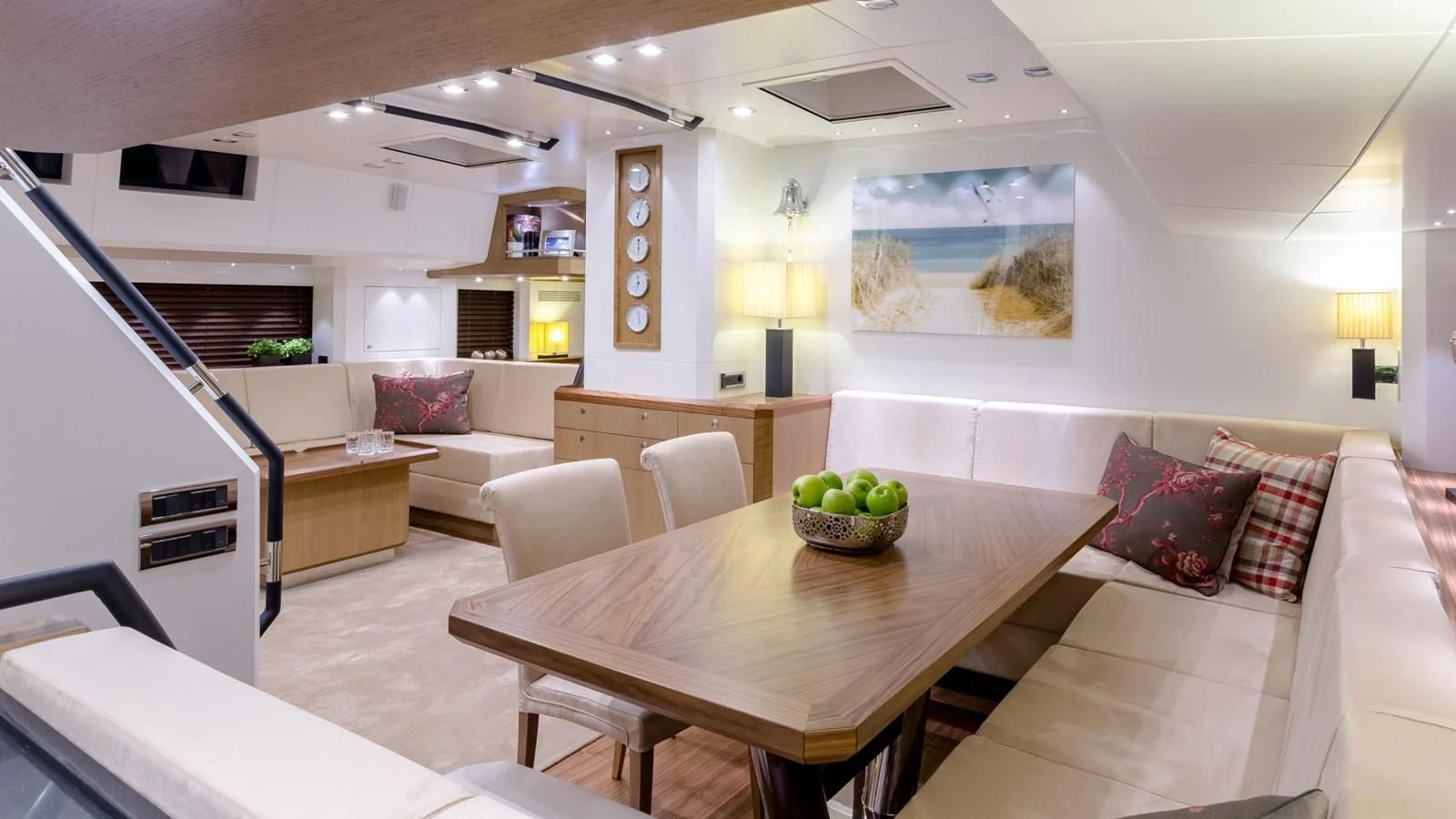 a living room with a table and couches aboard BELLKARA Yacht for Charter