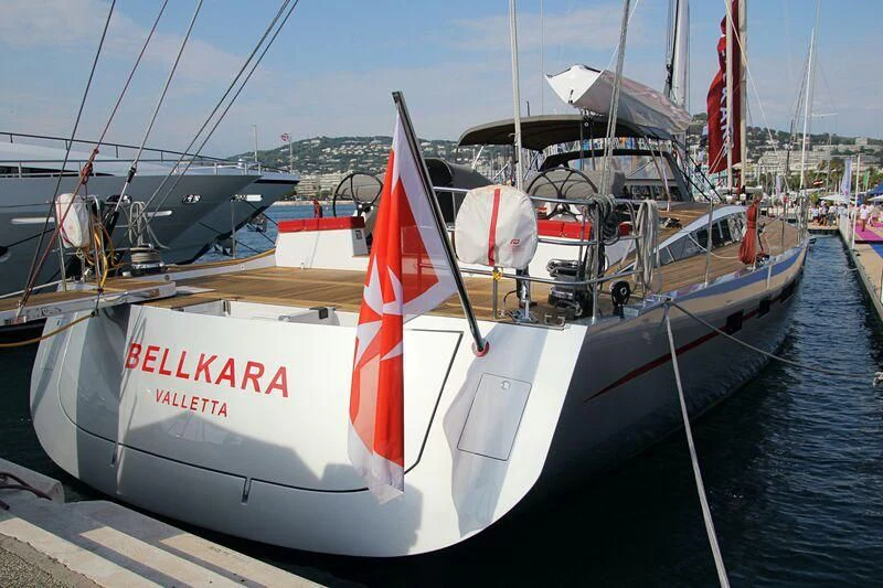 a boat with a flag on the front aboard BELLKARA Yacht for Charter