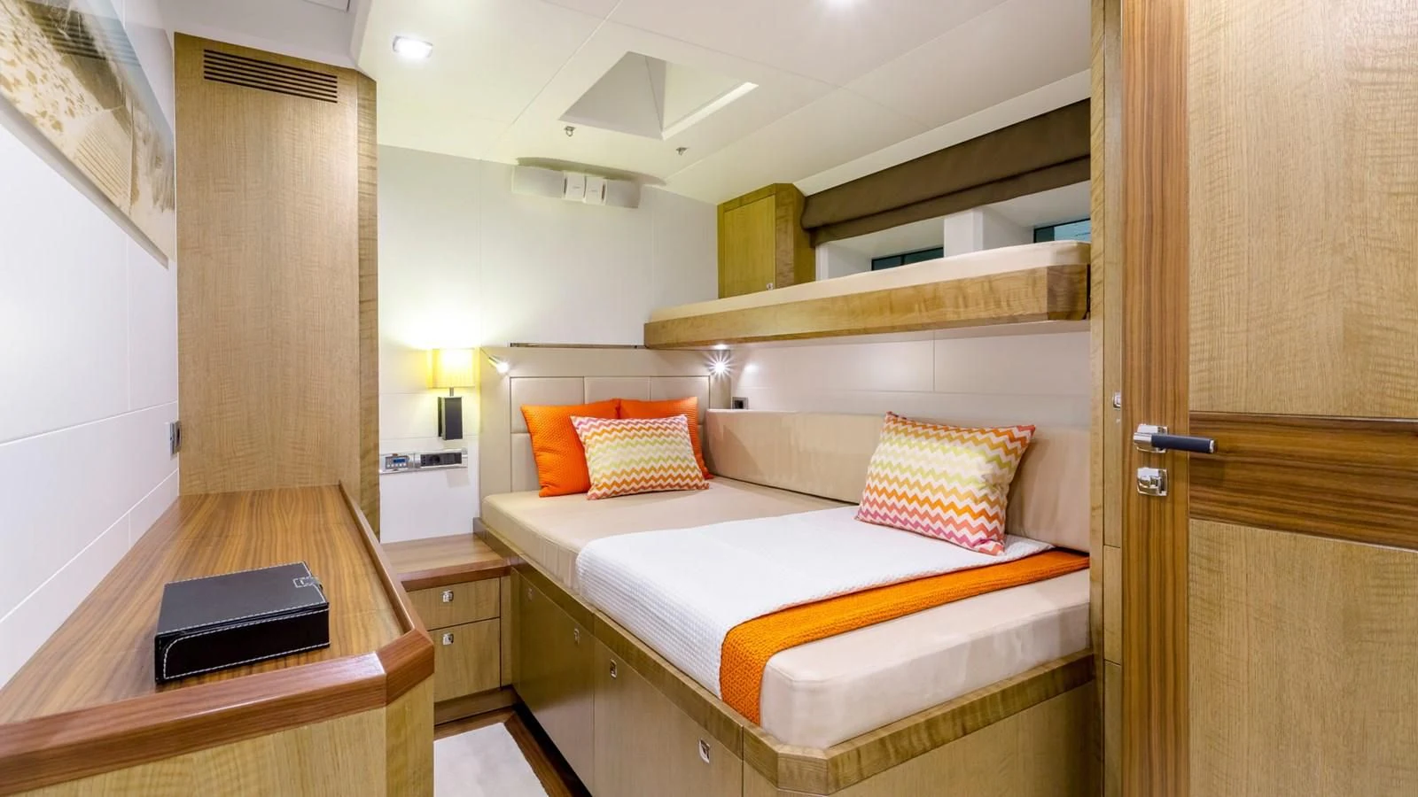 a room with a bed and desk aboard BELLKARA Yacht for Charter