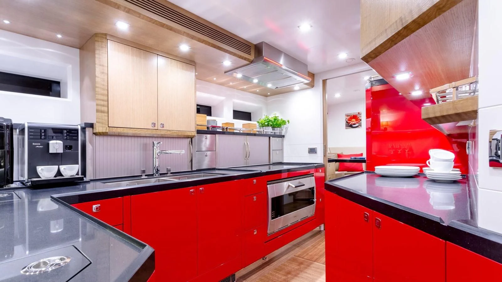 a kitchen with red cabinets aboard BELLKARA Yacht for Charter